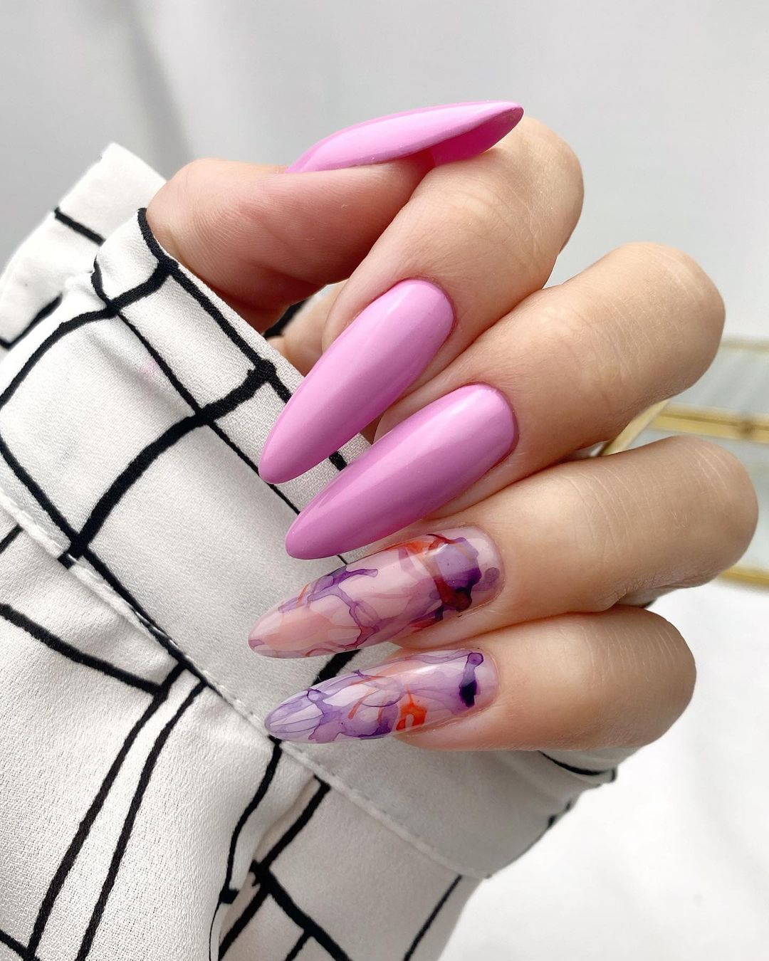 Long Glossy Almond Nails with Purple Marble Design