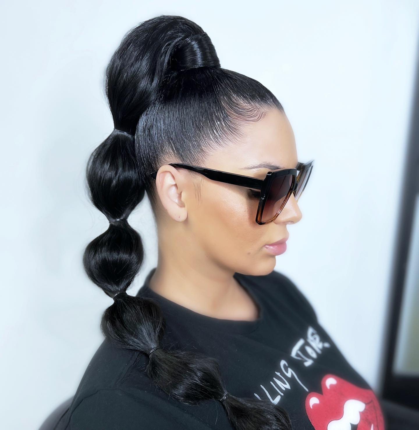 High Bubble Ponytail on Long Black Hair