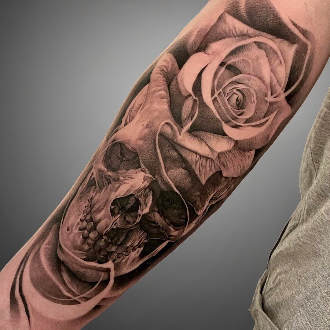 Large Skull and Rose Tattoo on Arm