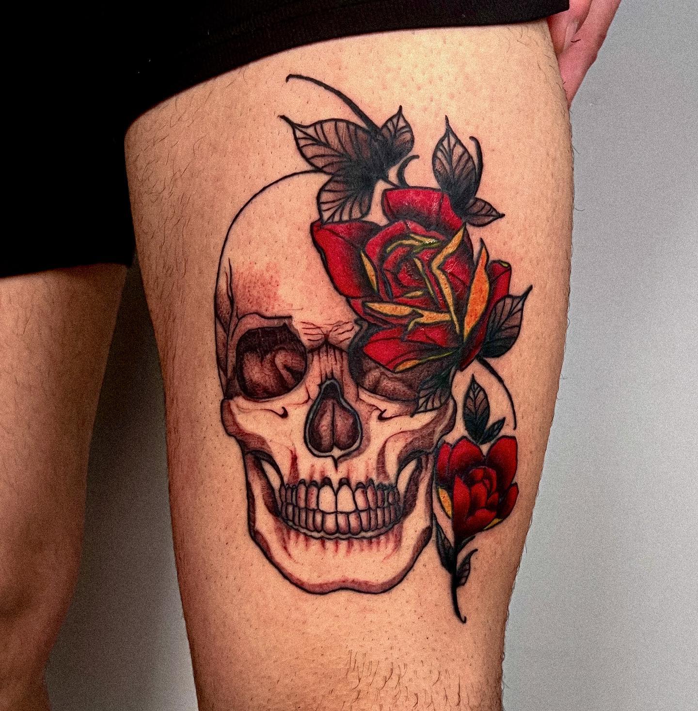 Red Rose and Skull Tattoo on Leg