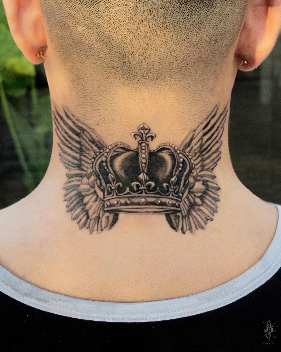 Crown and Wings Tattoo on the Back of the Neck for Men