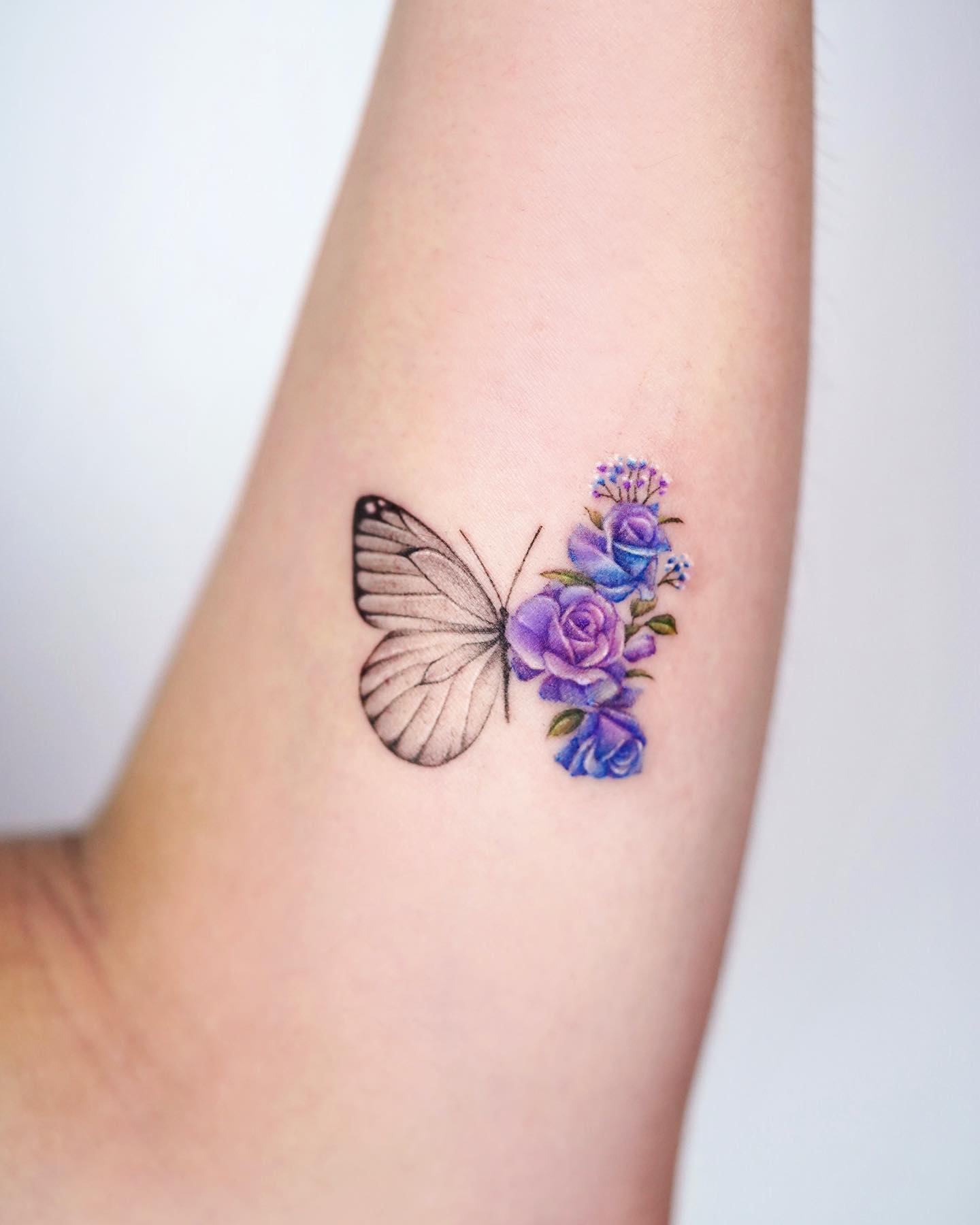 Small Butterfly and Rose Tattoo on Arm