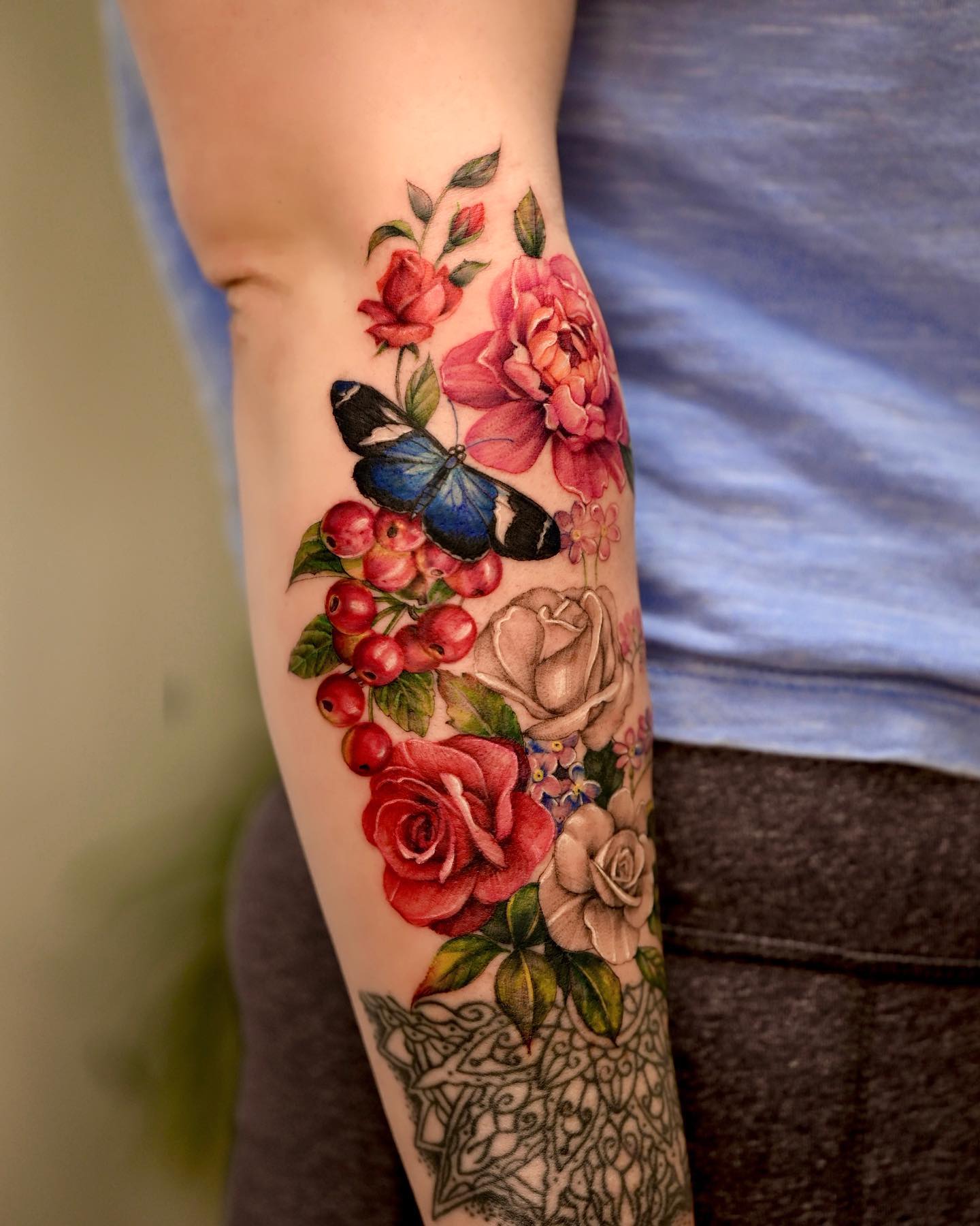 Red Roses and Butterfly Tattoo on Arm