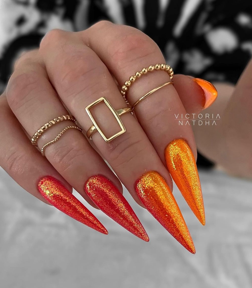 Bright Sparkly Orange Stiletto Nails