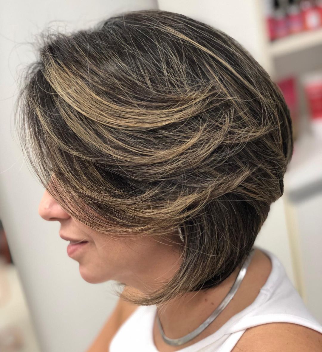 Layered Bob Cut on Dark Hair with Blonde Highlights