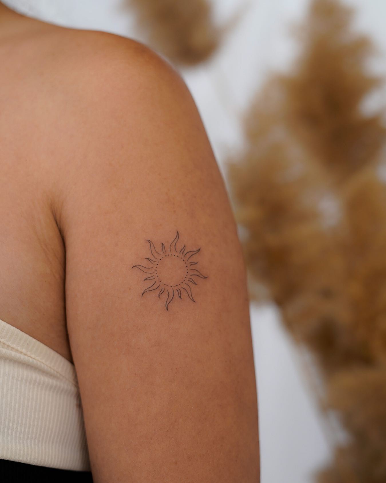 Tribal Sun Tattoo on Arm